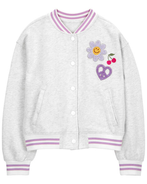 A grey kid’s varsity jacket with pink accents and embroidered patches