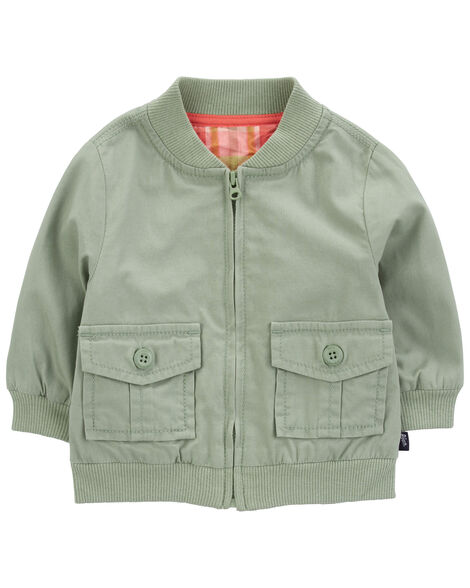 A green zip up baby jacket