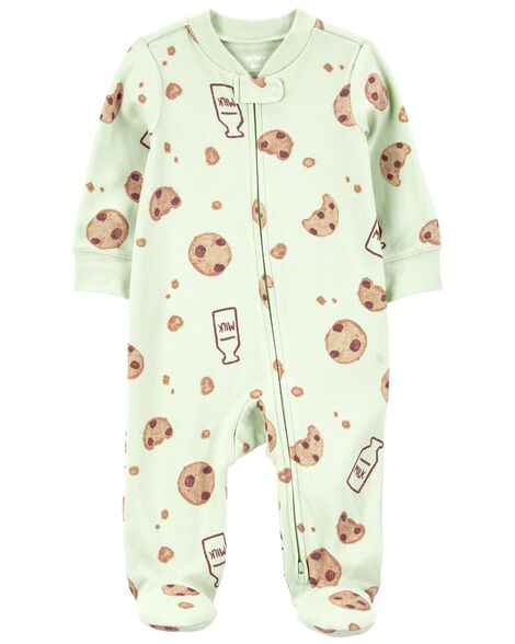 Green baby pajamas with a milk and cookies design