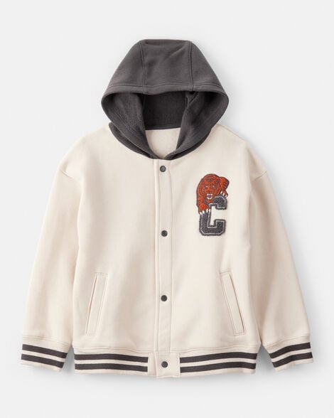 A cream-colored varsity jacket